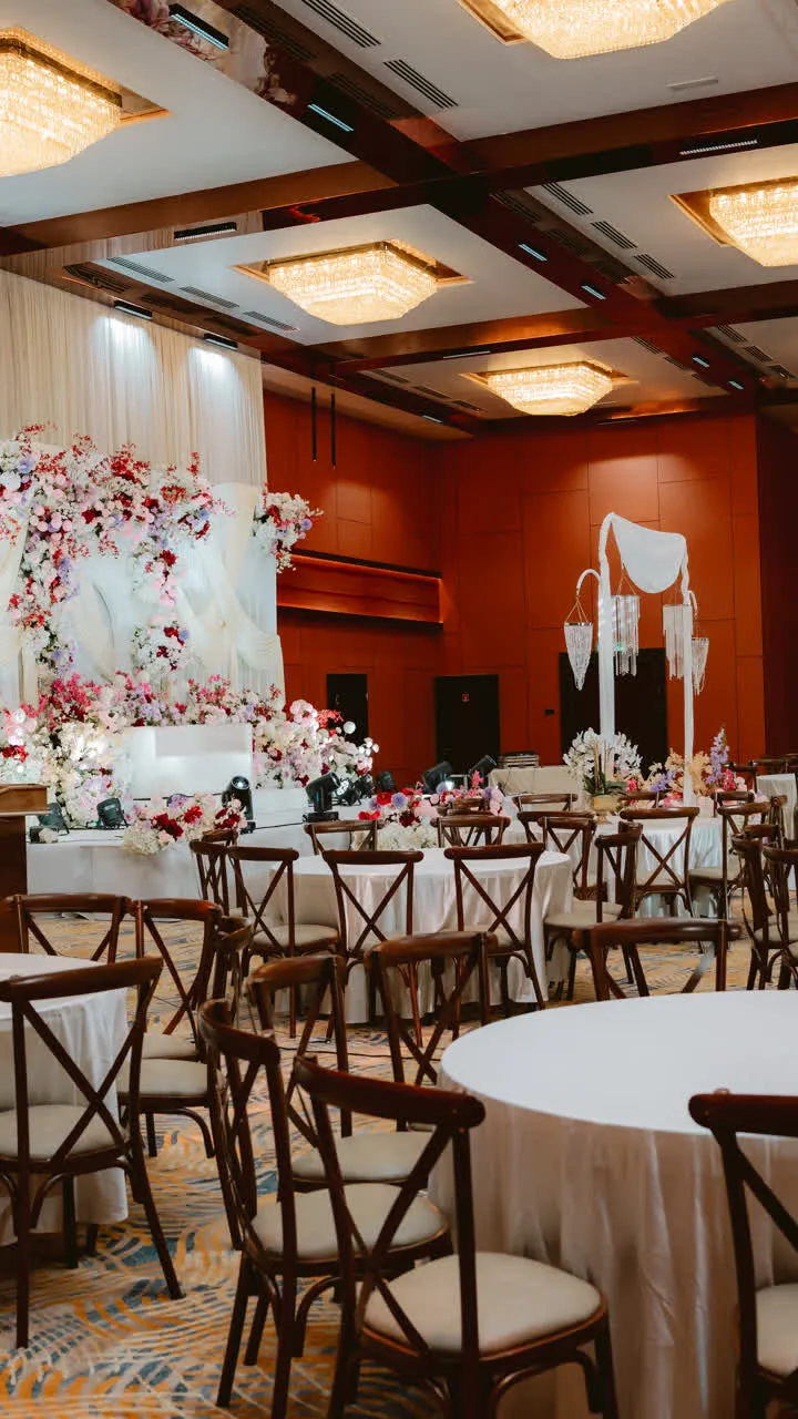 Wedding reception seating and floral stage setup